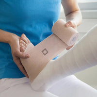 ankle being wrapped with the compri2 2-layered bandage system
