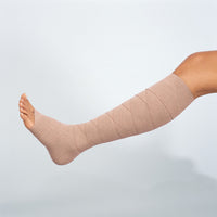 ankle being wrapped with jobst comprilan short stretch bandages