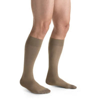 man wearing jobst formen casual knee high compression sock closed toe in tan khaki, right view
