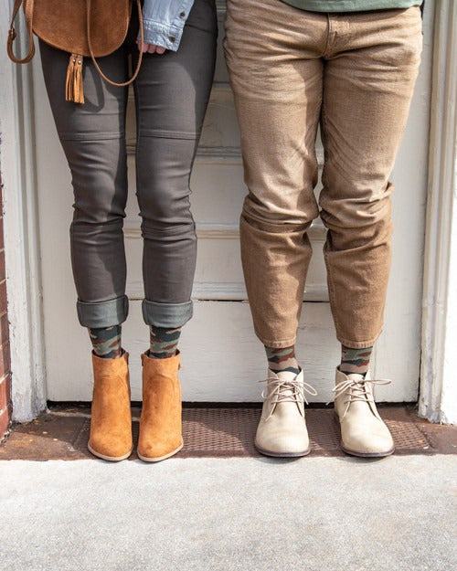 two people wearing the medi rejuva compression sock in camo green colour