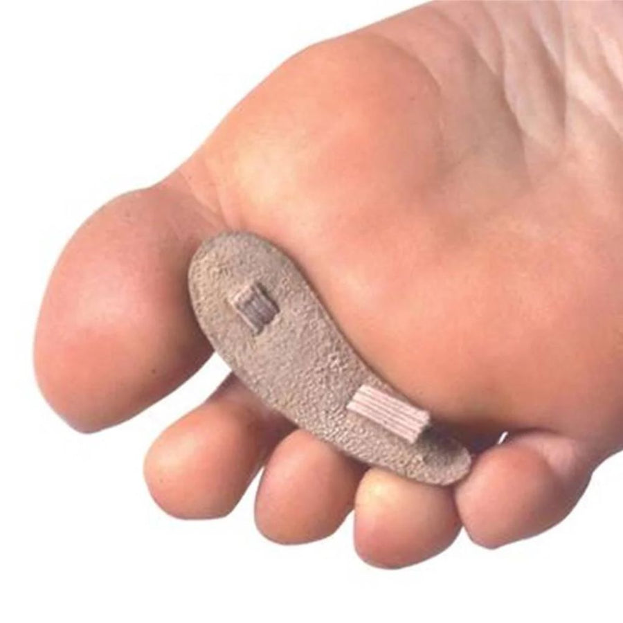 Foot model wearing a Pedifix Hammer Toe Crest Suede Deluxe, back view of the foot.