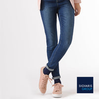 woman wearing sigvaris navy blue casual cotton compression socks with rolled-up jeans and pink sneakers