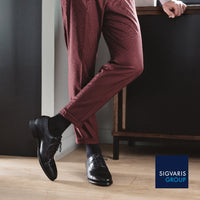 man in suit wearing sigvaris black casual cotton compression socks