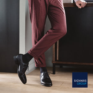 man in suit wearing sigvaris black casual cotton compression socks