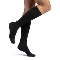 Sigvaris 262 bamboo compression sock knee high side view, in black.