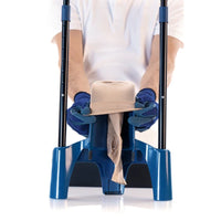 person using gloves to stretch a compression sock over sigvaris melony donning aid, preparing it for foot insertion