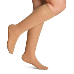 side view of closed toe golden sheer compression socks