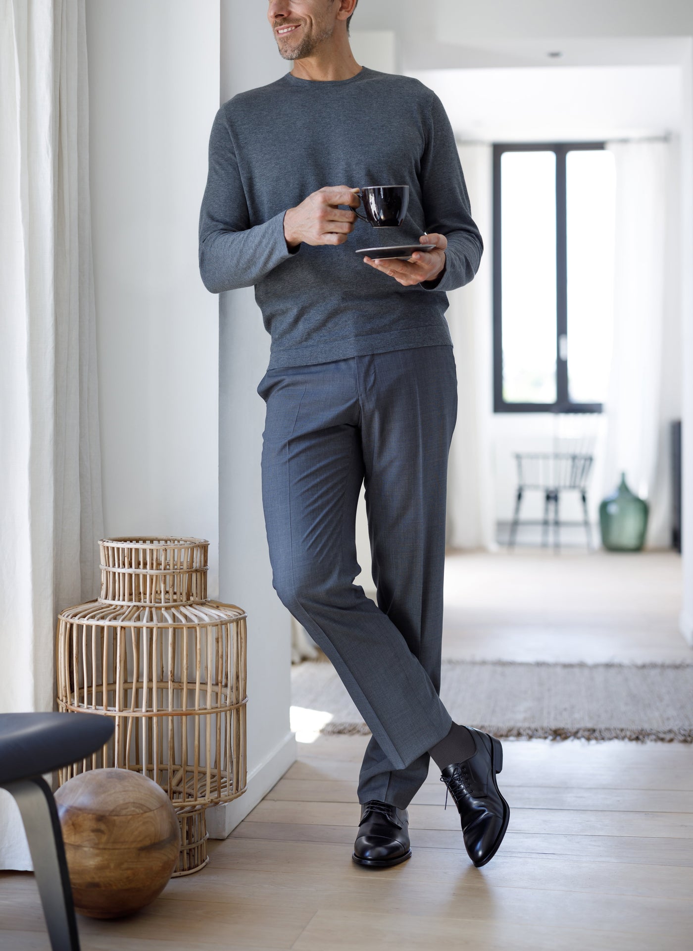man in a grey suit wearing sigvaris steel grey mcirofibre compression sock