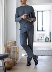 man in a grey suit wearing sigvaris steel grey mcirofibre compression sock