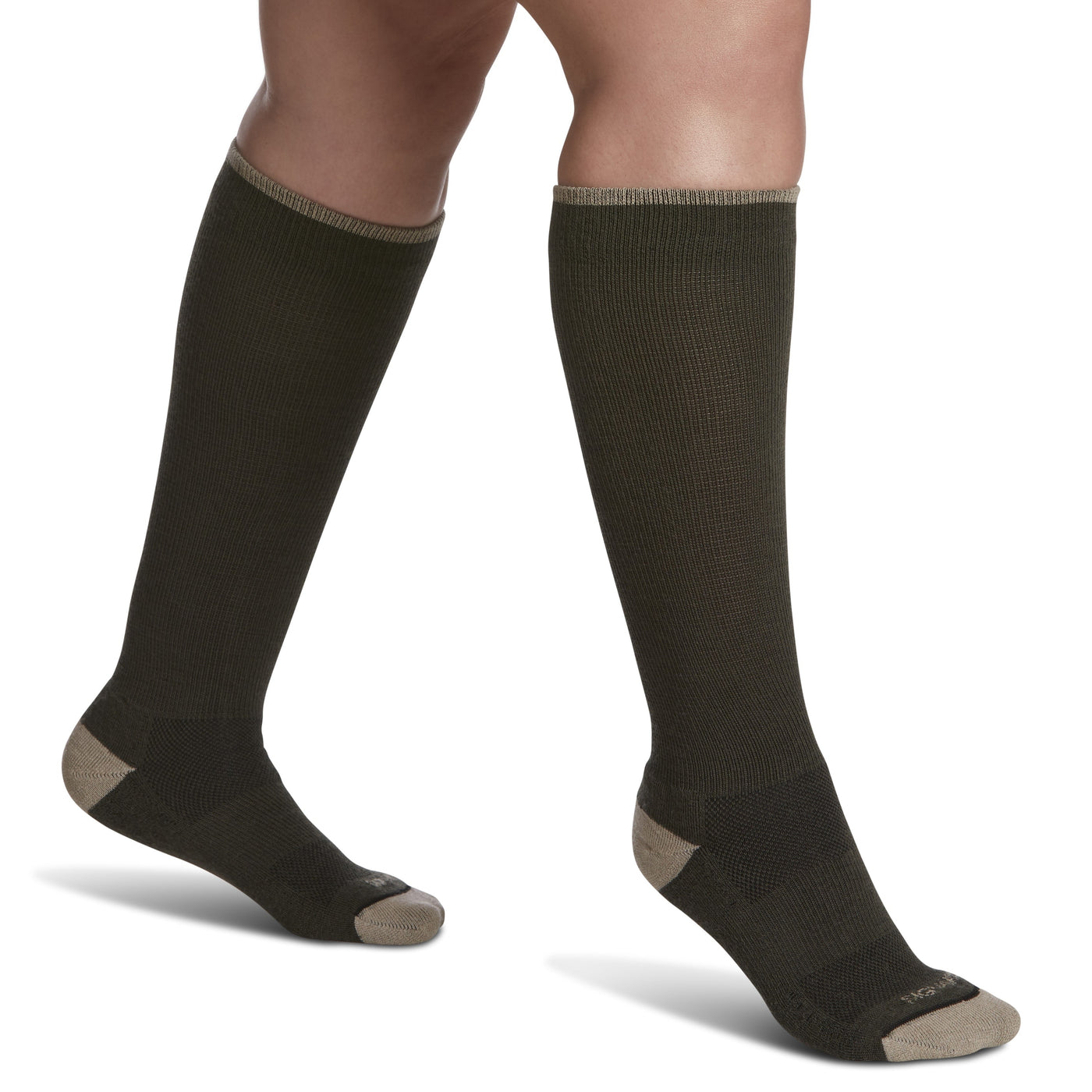 close-up of a leg wearing sigvaris merino wool outdoor compression sock in olive colour, side view.